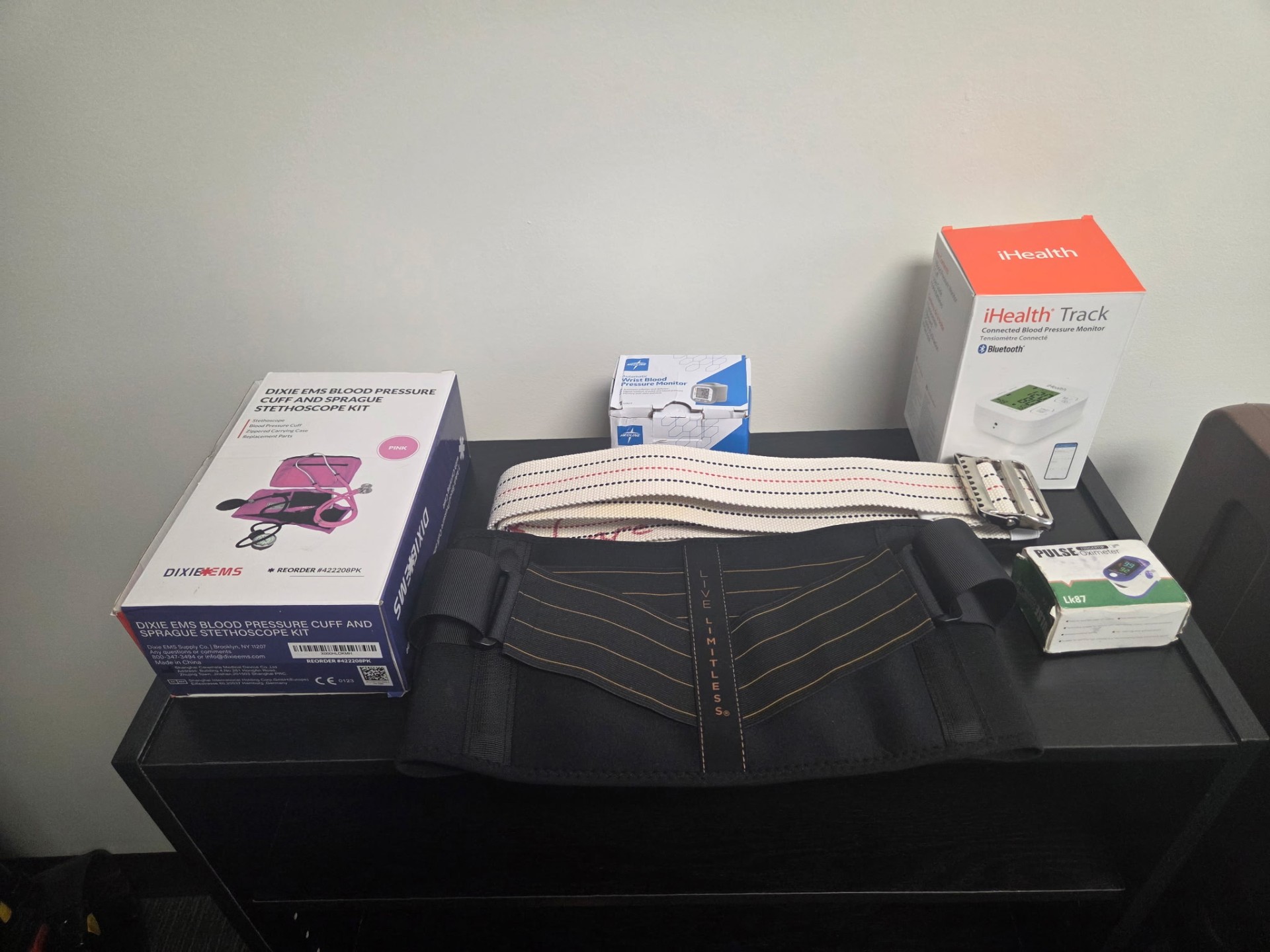 Blood pressure cuffs, pulse oximeter, gait belt, and medical monitoring supplies for caregiver training